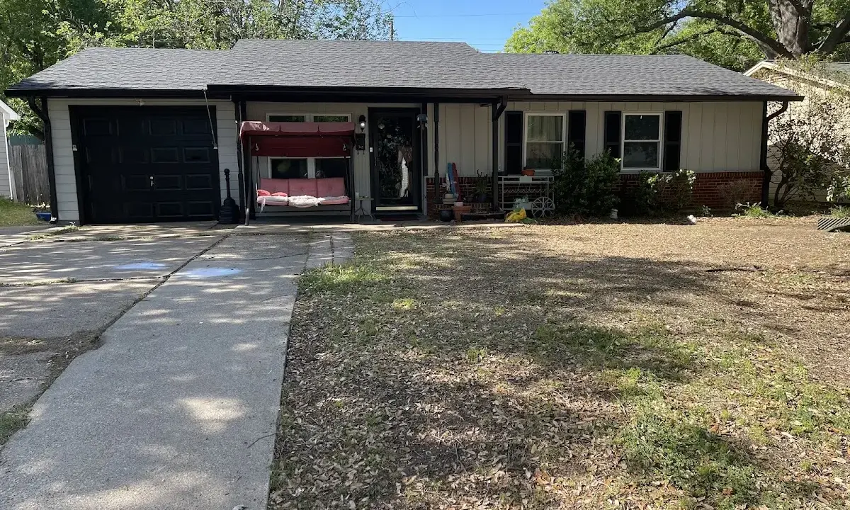 Asphalt Shingle Roof Repair crew at work on a residential roof in Selma